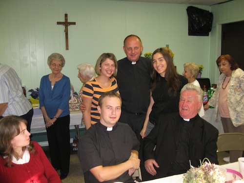 Seated - Fr. Kolek, Fr. Senior Pietruszka, and standing - Fr. Koterba with dinner guests.